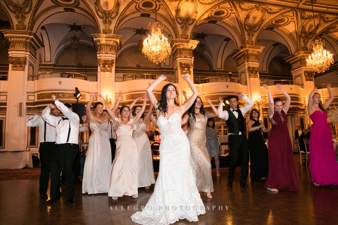bride dances while guests cheer her on