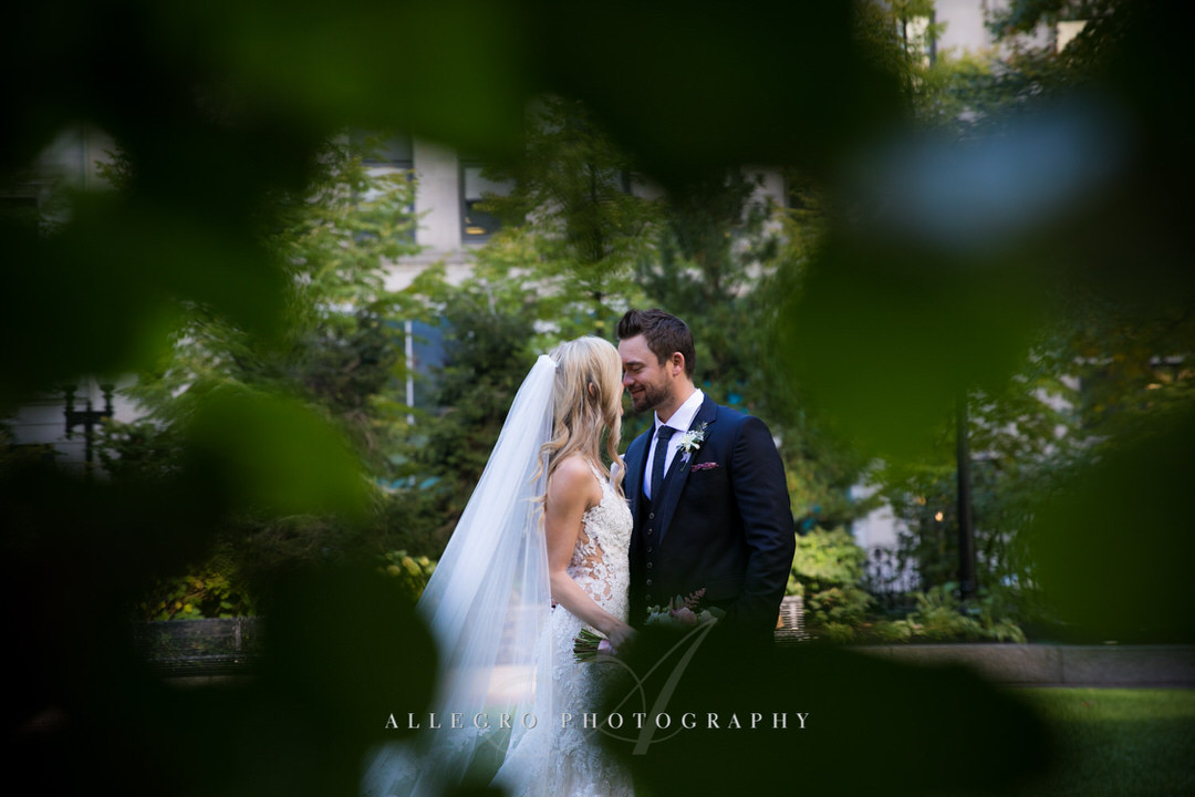 bride and groom kiss in post office square
