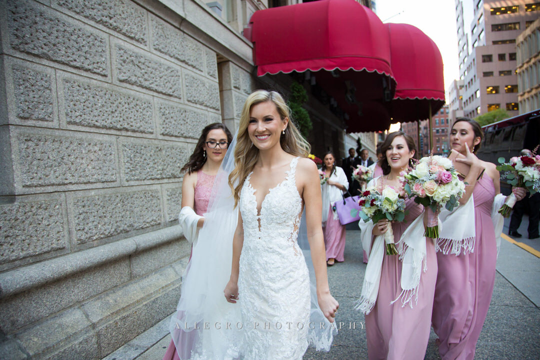 Bride walking with her bridesmaids