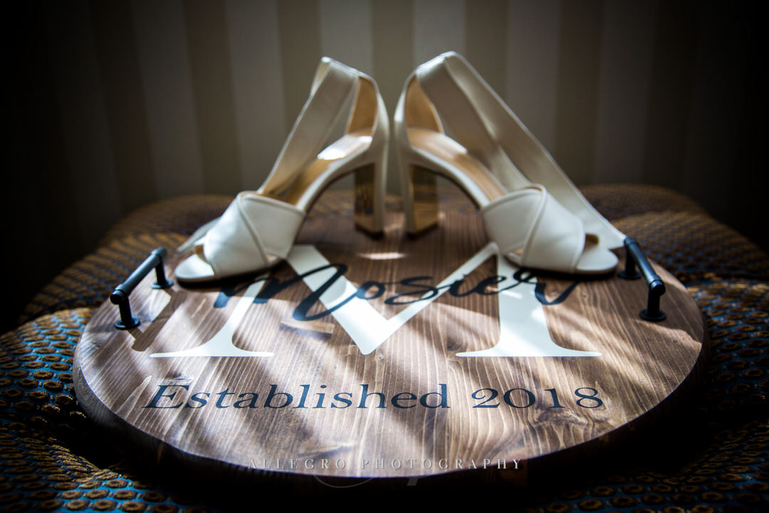 brides heels with name board