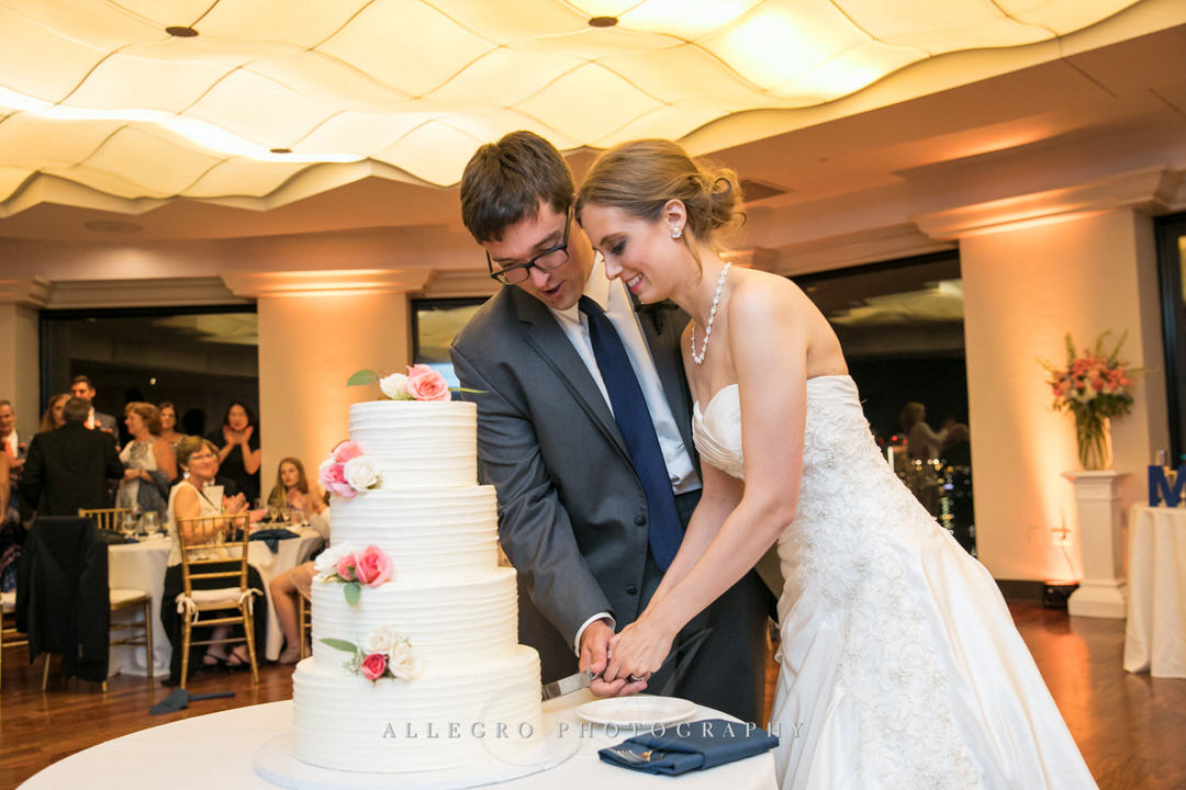 bride and groom cut the cake together