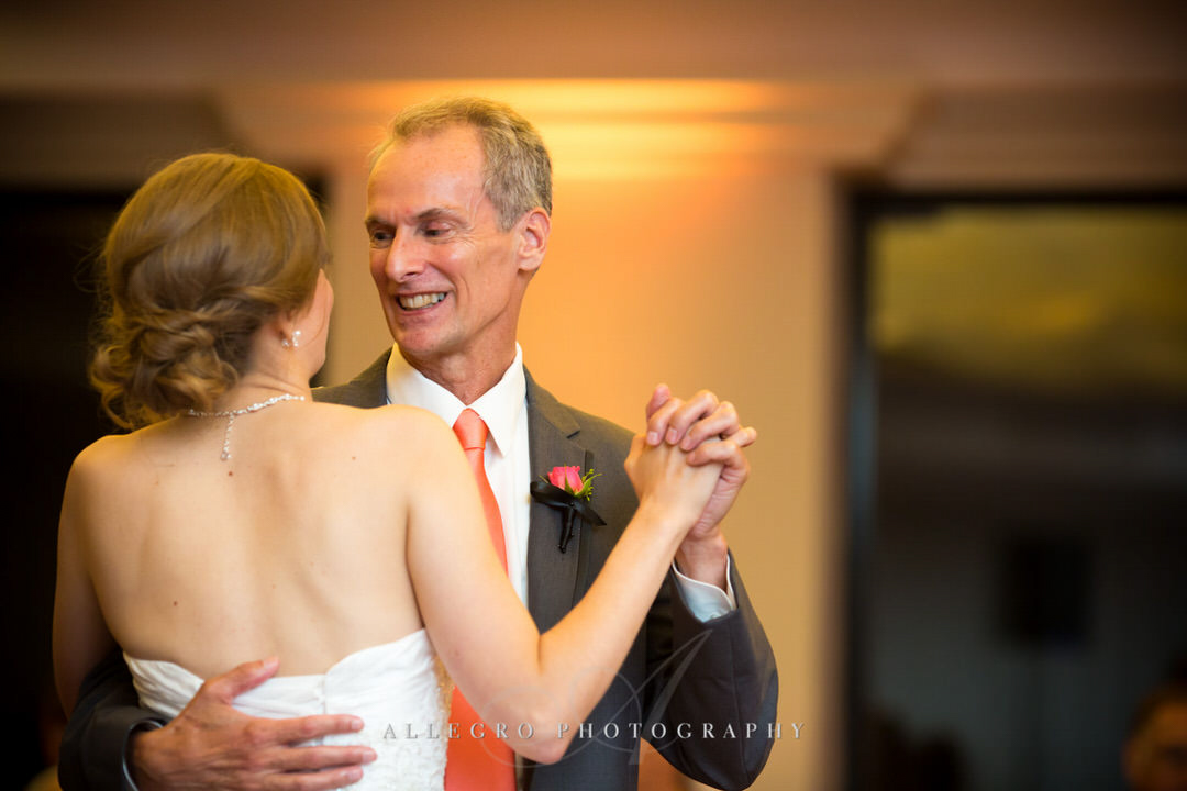 father of the bride smiles as they share their dance