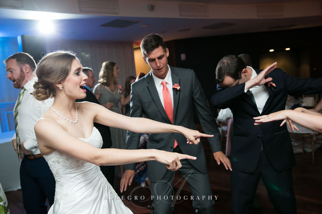 bride and groomsman dancing