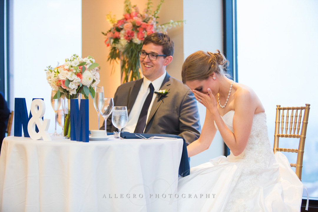 bride laughs while father of the bride makes toast