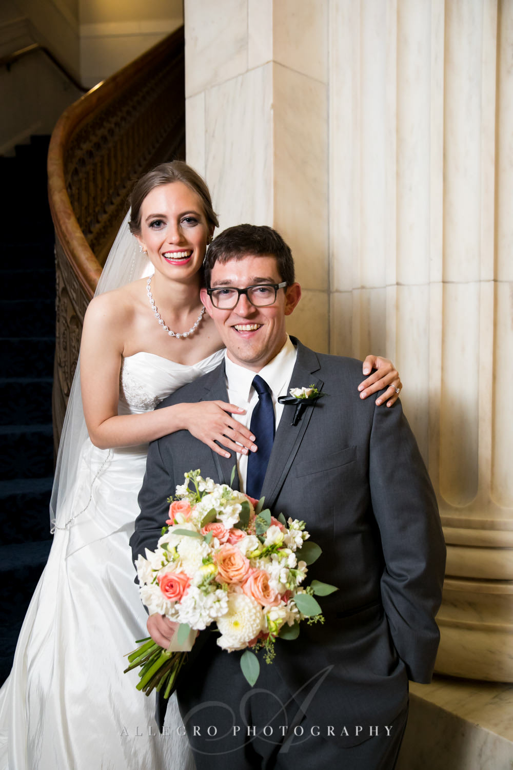 bride and groom pose together in custom house