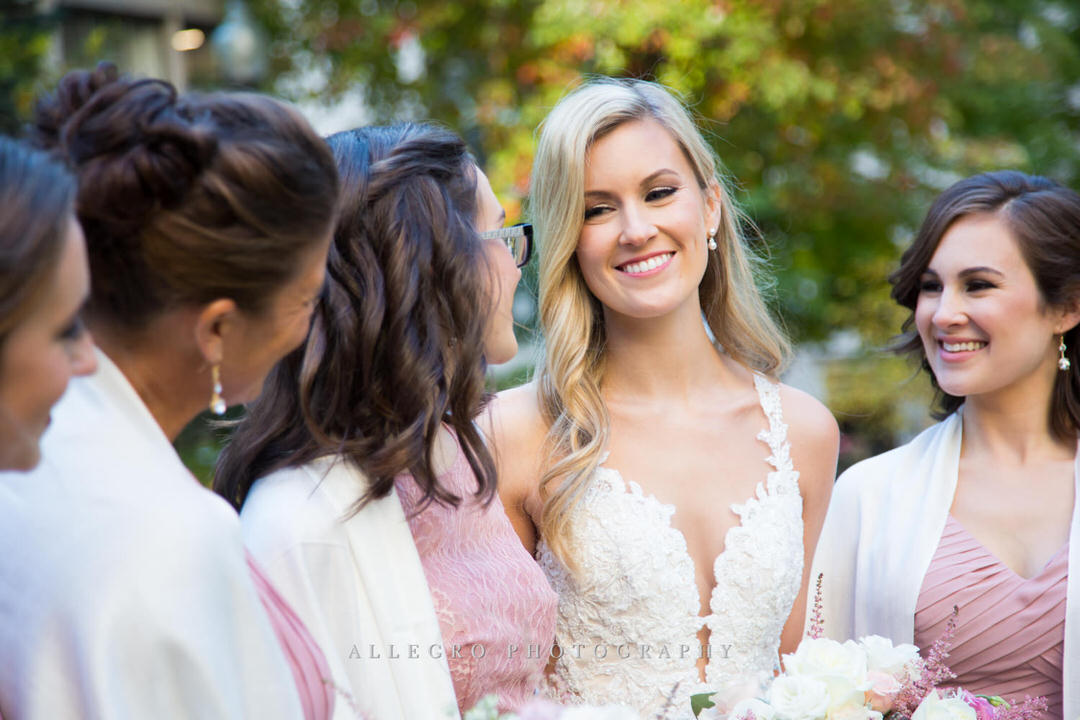 bride looking at her bridesmaids