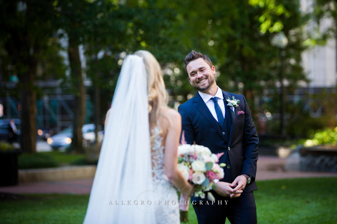 Grooms first look at bride in post office square