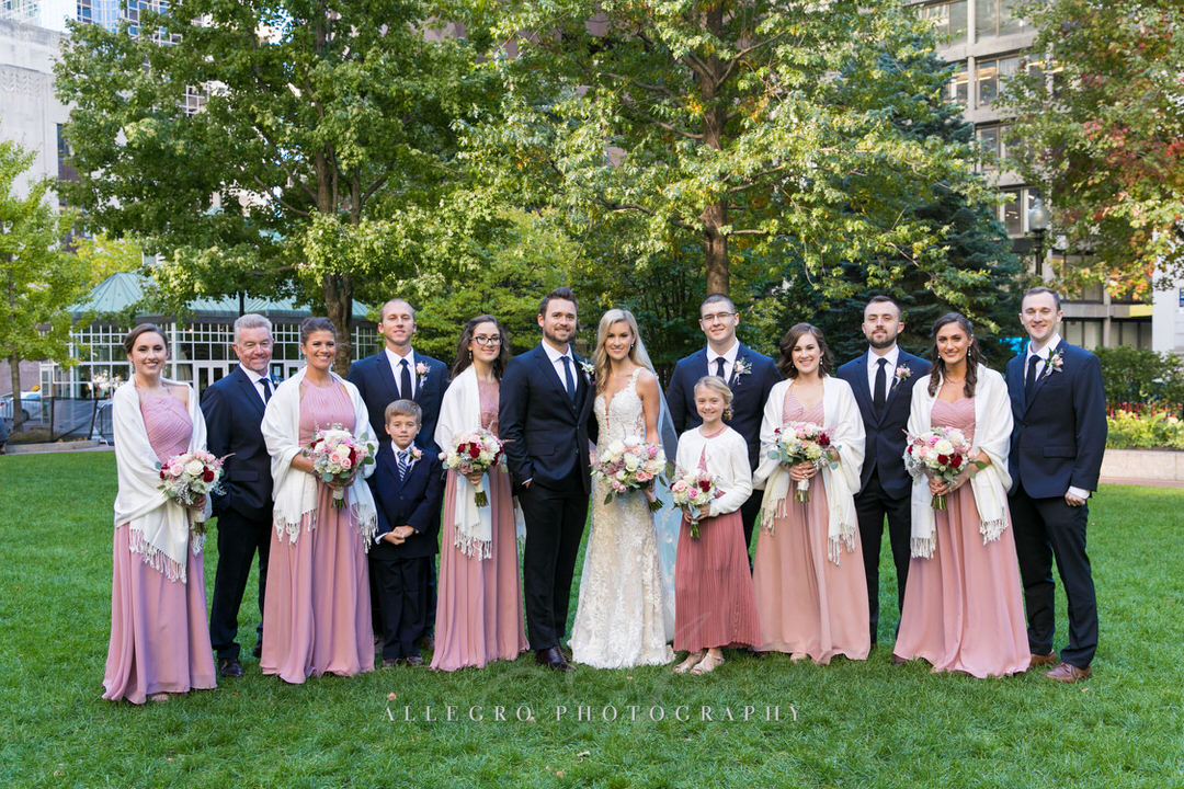 bride and groom with their bridesmaids and groomsmen in post office square